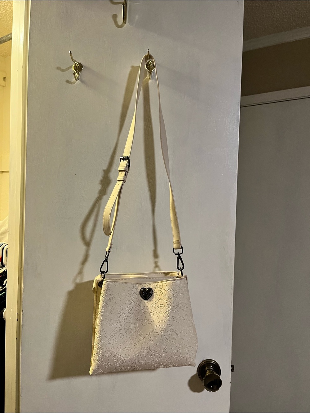 Betsey Johnson Cream Embossed Crossbody with Black Heart Accent